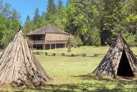 Miwok village with ceremonial hun’ge (roundhouse) at Indian Grinding Rock State Historic Park near Jackson, CA