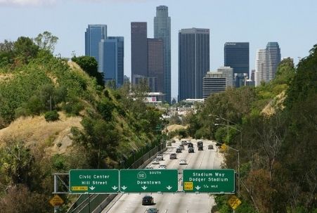 Freeway heading into Los Angeles with downtown buildings in the background