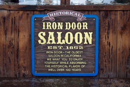 "Est. 1852" sign on the door at Iron Door Saloon in Groveland, CA
