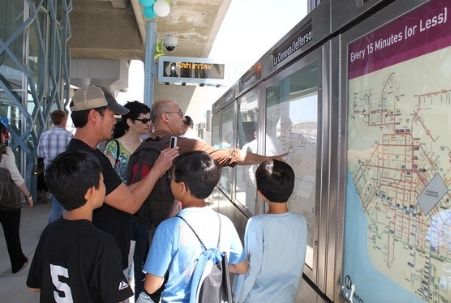 Riders looking at Los Angeles Metro station map