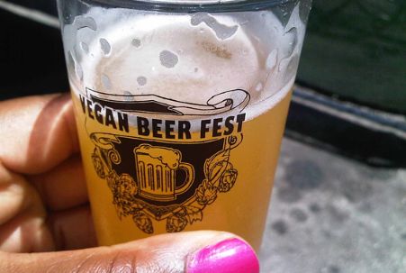 Woman holding beer at Vegan Beer Fest in Los Angeles